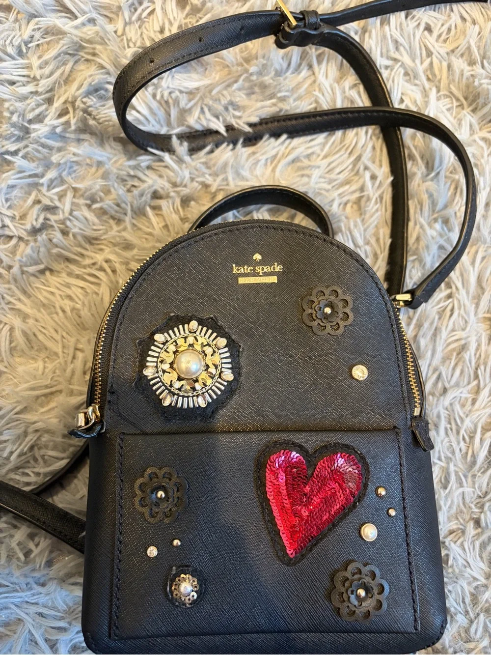kate spade black mini backpack with red sequin heart and floral studs